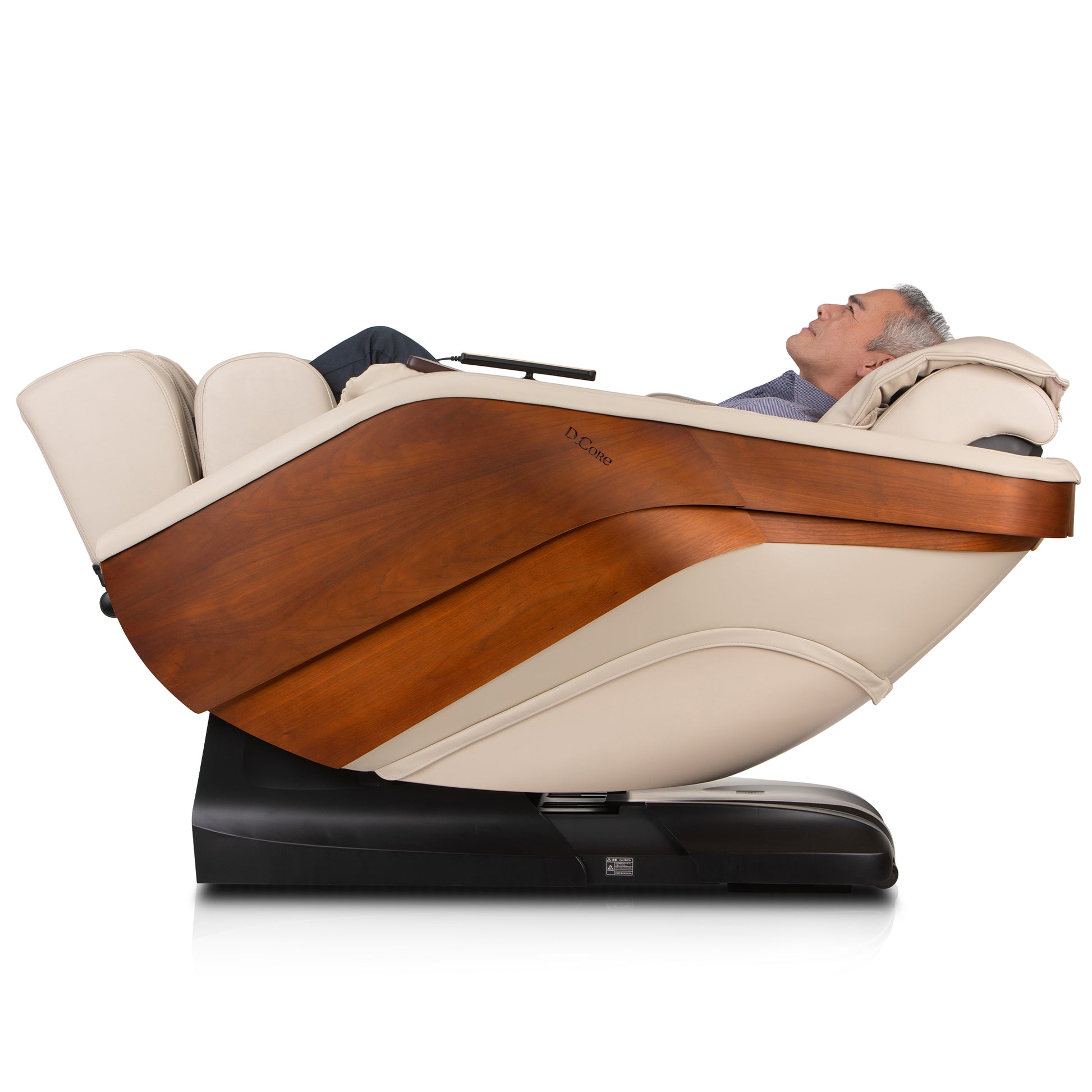 DCore STRATUS electric massaging chair in cream and wood finish with man reclining comfortably