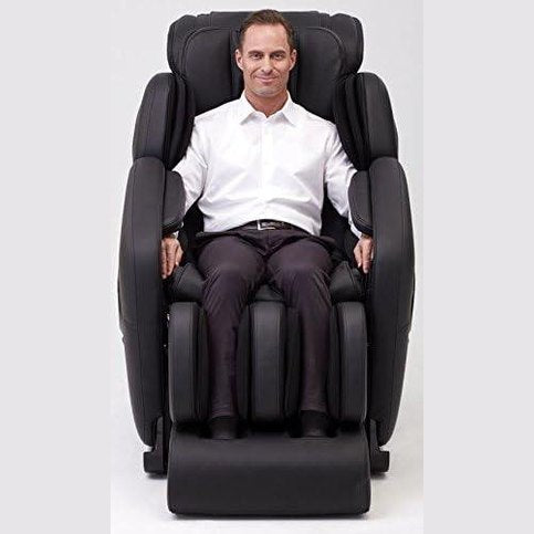 Man sitting comfortably in black Inner Balance Jin Massage Chair with full body massage features