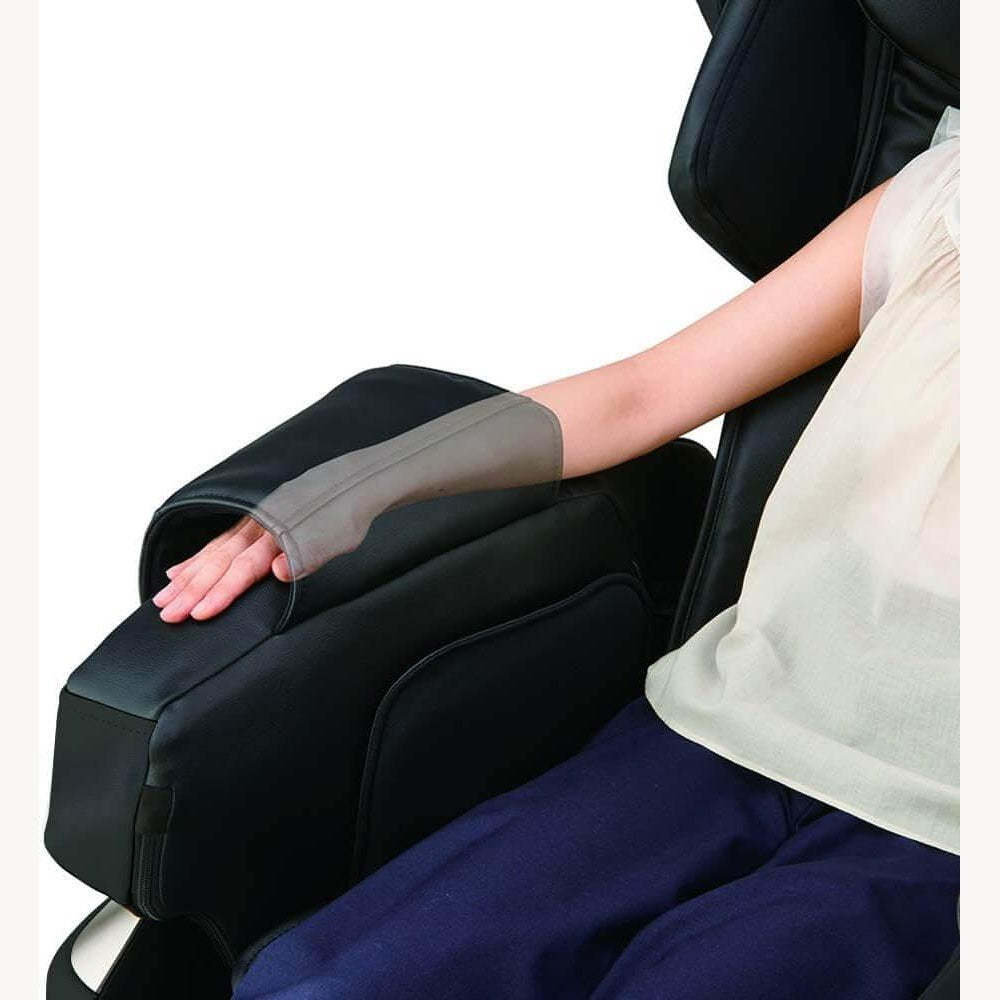 Person using black Kurodo Massage Chair by Synca Wellness with electric arm massager feature