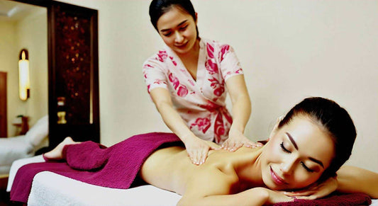 Woman enjoying a professional massage, emphasizing relaxation similar to Hisho Massage Chair experience