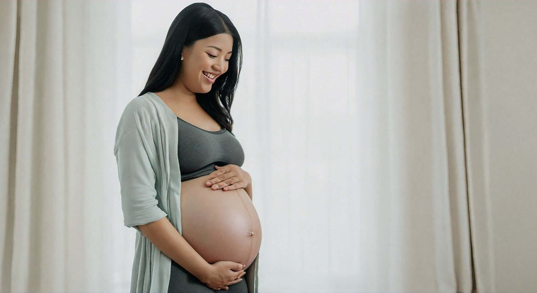 Pregnant woman smiling while gently holding her belly, promoting safety of massage chairs during pregnancy