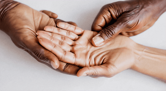 Therapist hands applying palm pressure on client to illustrate massage chair technology for Chinese acupressure benefits