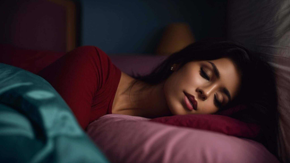 Sleeping woman resting on a pink pillow, wearing a red top and partly covered by a teal blanket; How a Massage Chair Can Help You Get Better Sleep Tonight