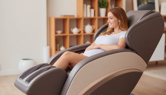 Pregnant woman relaxing in a massage chair considering are massage chairs safe during pregnancy