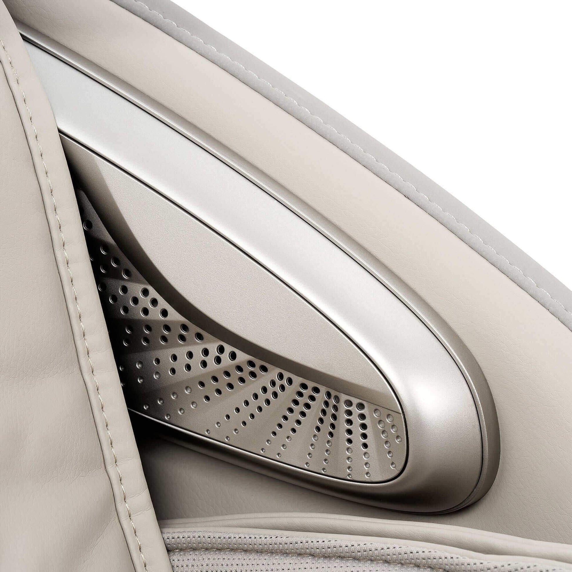Close-up of Fujiiryoki Calm Plus massage chair armrest with perforated metal detail and beige leather upholstery