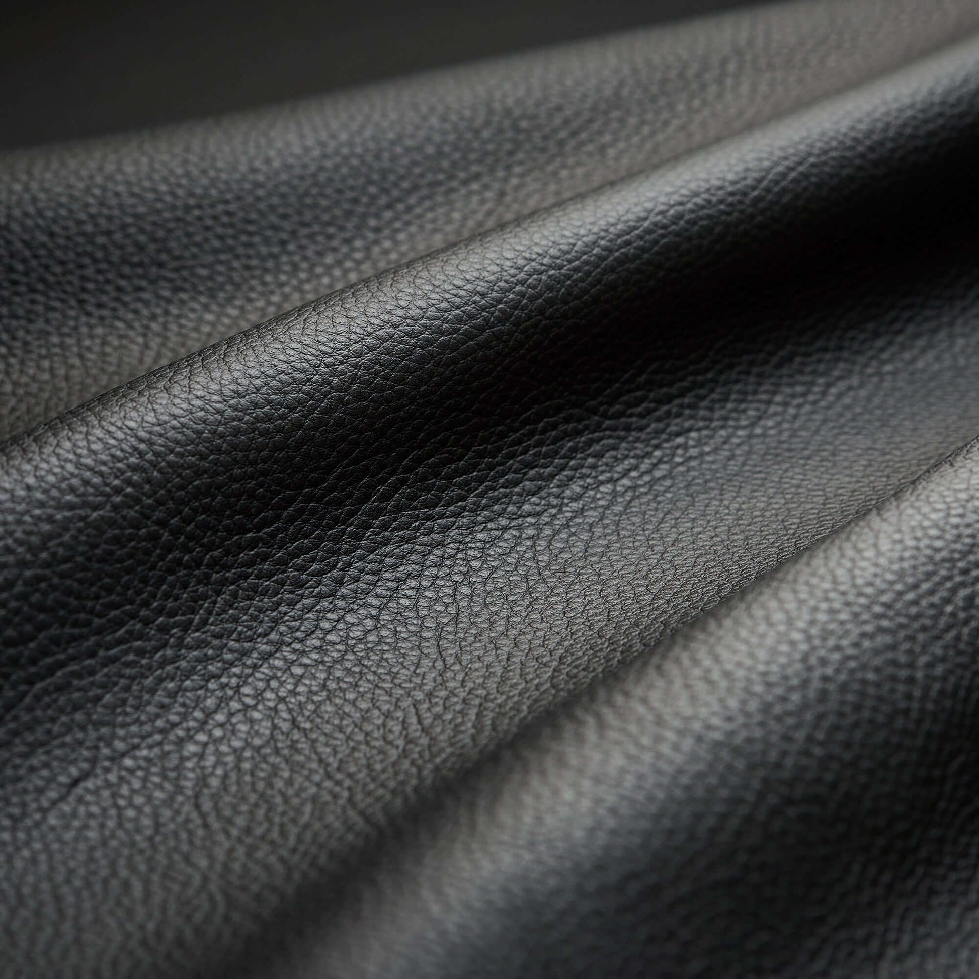 Close-up of black leather material used in Fujiiryoki Cyber Relax Ai electric massaging chairs