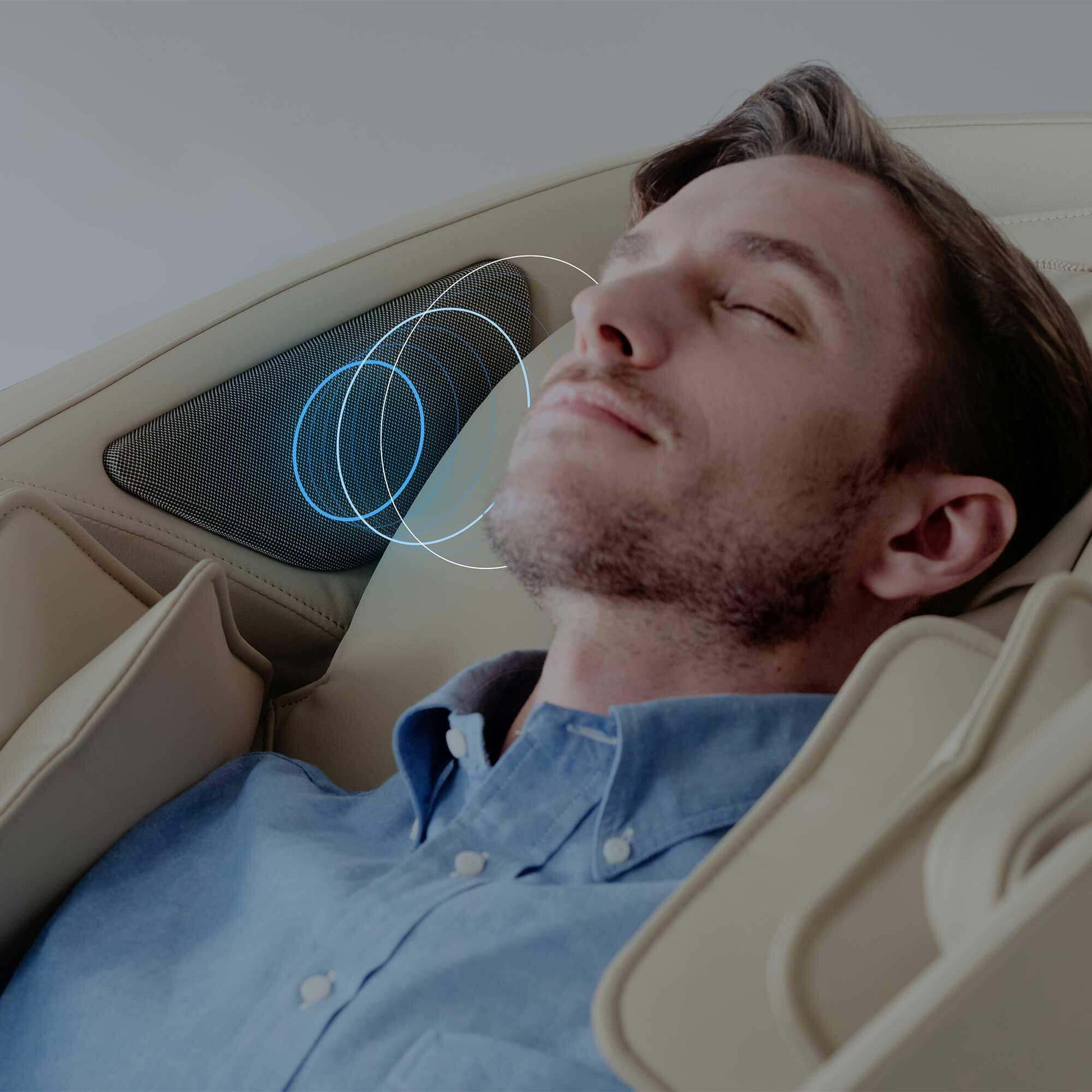 Man relaxing in a Fujiiryoki Cyber Relax Elite Massage Chair with neck and shoulder massage features