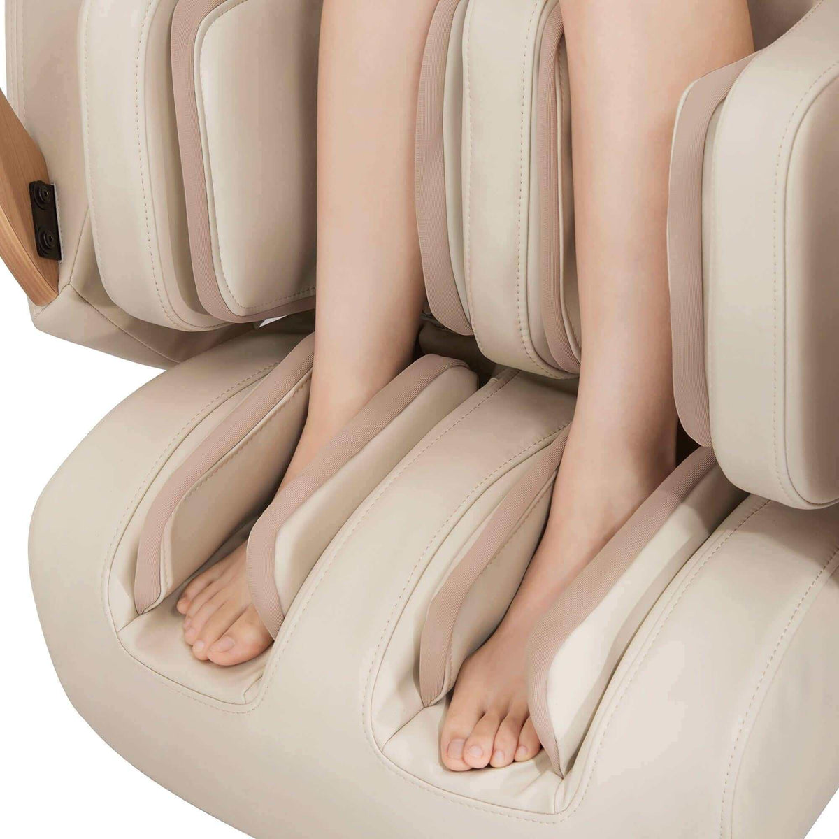 D.Core 2 massage chair with cream upholstery, padded foot wells and calf rollers holding bare feet