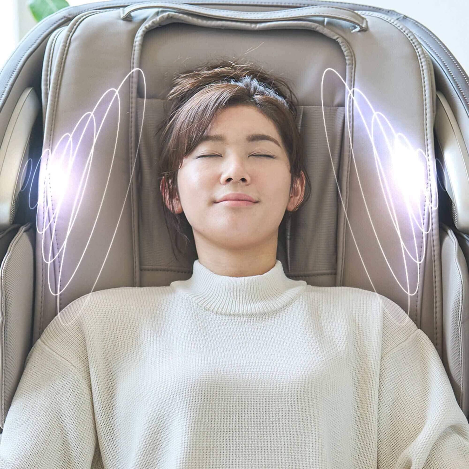 Woman reclining with eyes closed in Fujiiryoki Calm Plus Massage Chair showing neck and shoulder therapy