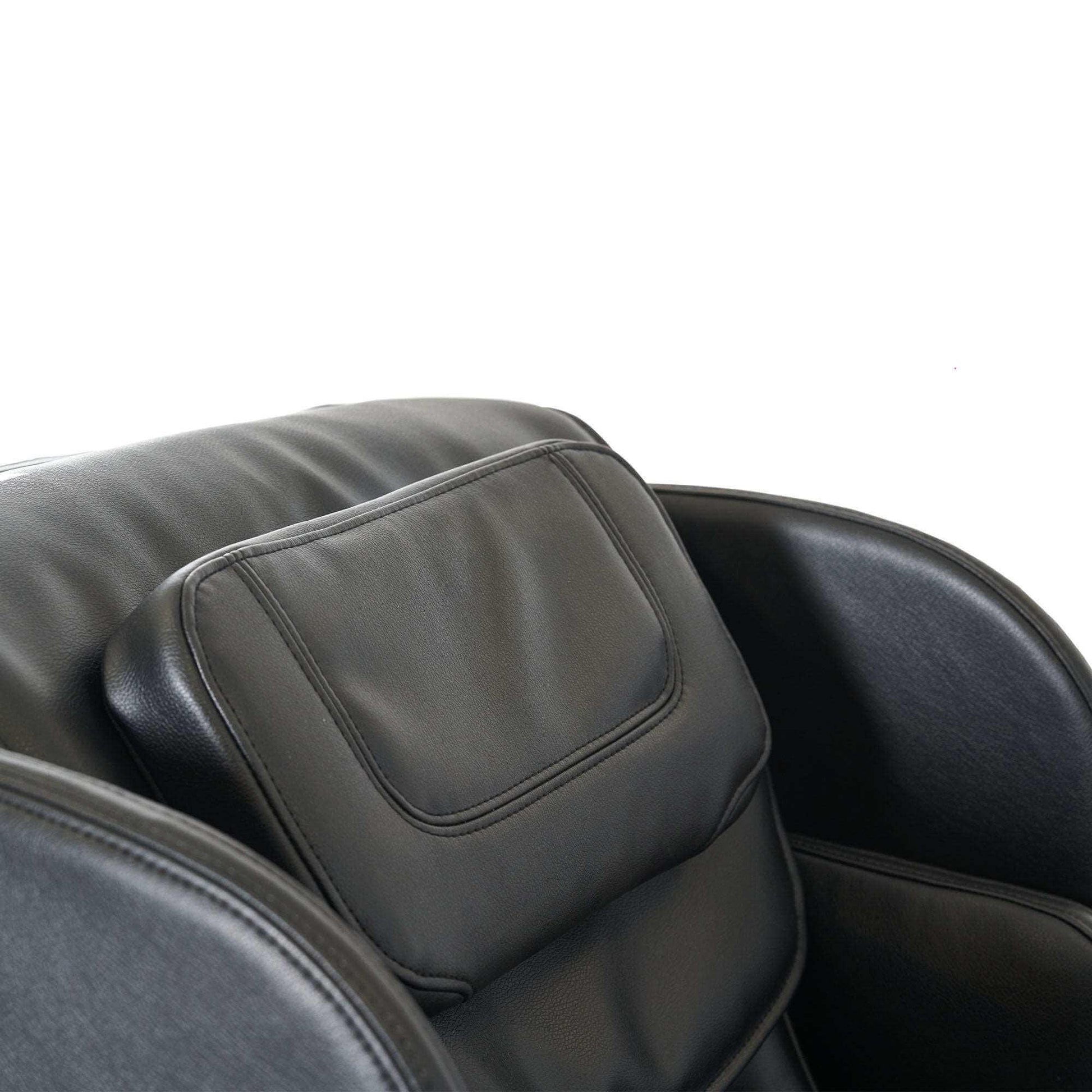 Close-up of Synca Wellness black leather electric commercial massage chair with cushioned armrests