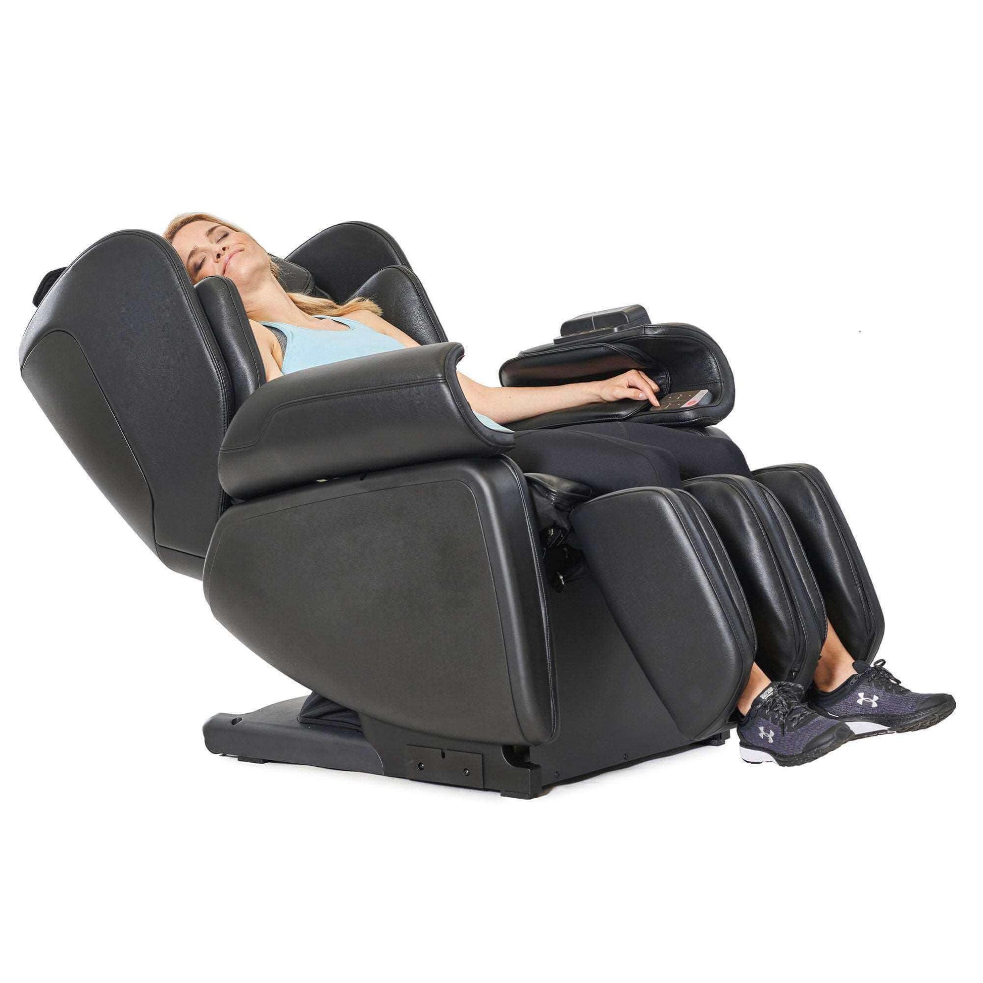 Synca Wellness black commercial massage chair with electric reclining and leg massager in use