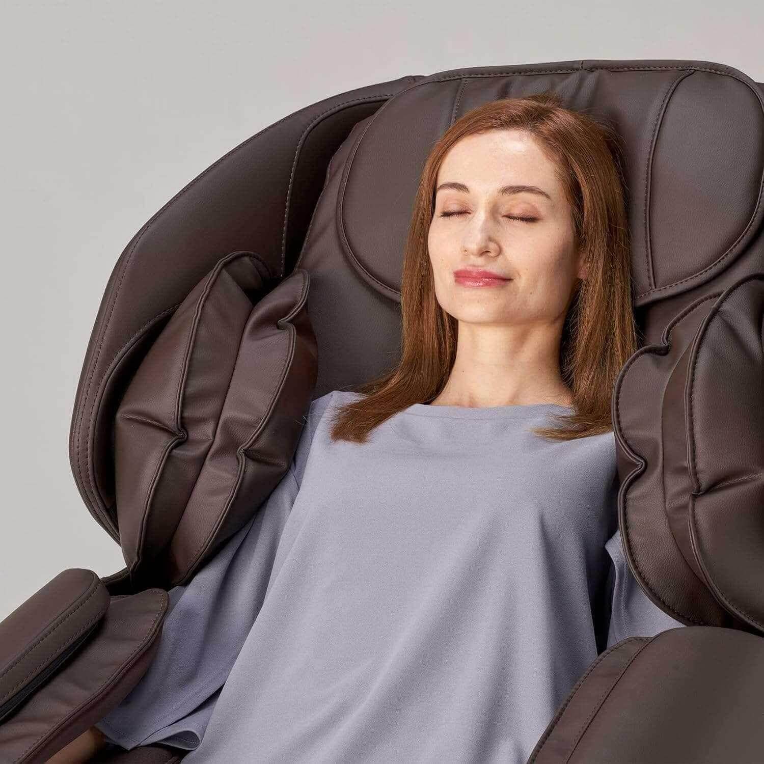 Woman enjoying relaxation in Hisho massage chair with plush cushioning and ergonomic design
