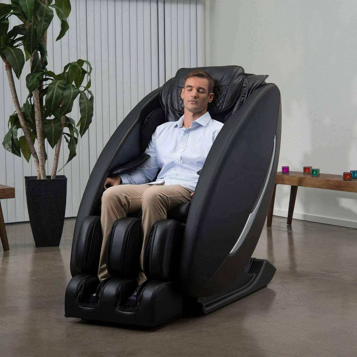 Massage chair, Ji - SL Track, in black synthetic leather with a sleek padded shell, foot massagers and reclining design