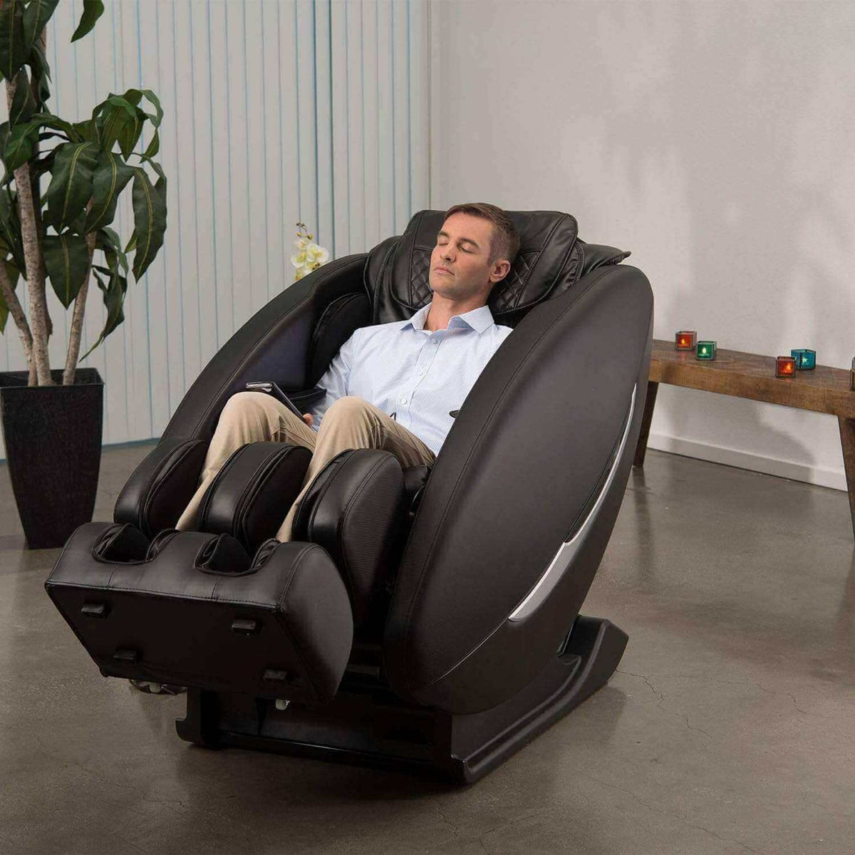 Massage chair, Ji - SL Track, in dark brown synthetic leather with padded arm and leg compartments and curved shell