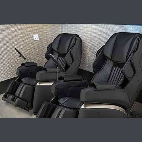Kurodo Executive massage chair in black leather with padded armrests, segmented footrests and contoured reclining body