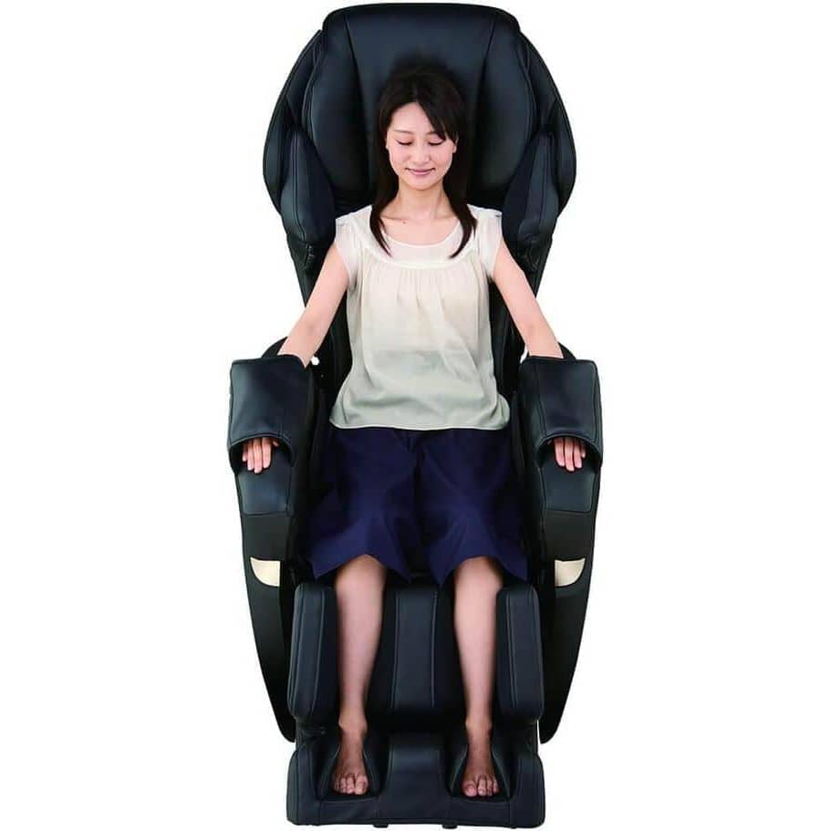 Kurodo Executive massage chair in black leather with padded armrests, leg supports and a woman seated upright